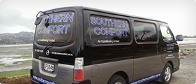 Rear view of the Southern Comfort Air Conditioning branded van parked by the estuary in Christchurch